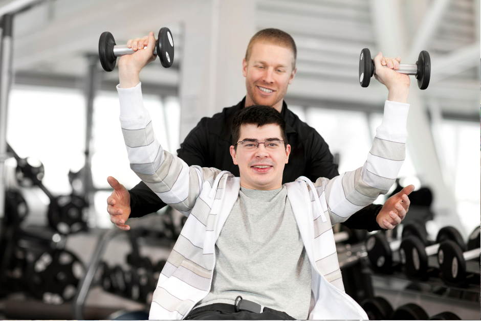 Man with disability lifting weights to achieve his fitness goal Assists daily activities MasRic Health Registered NDIS Service Provider in Geelong and Surf Coast