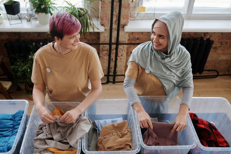 Support worker helping participant in folding and sorting out her laundry Household tasks MasRic Health Registered NDIS Service Provider in Geelong and Surf Coast