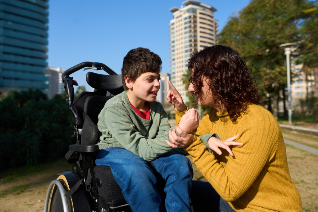 Support worker focusing on her participant while in the park Masric Health Registered NDIS Service Provider in Geelong and Surf Coast